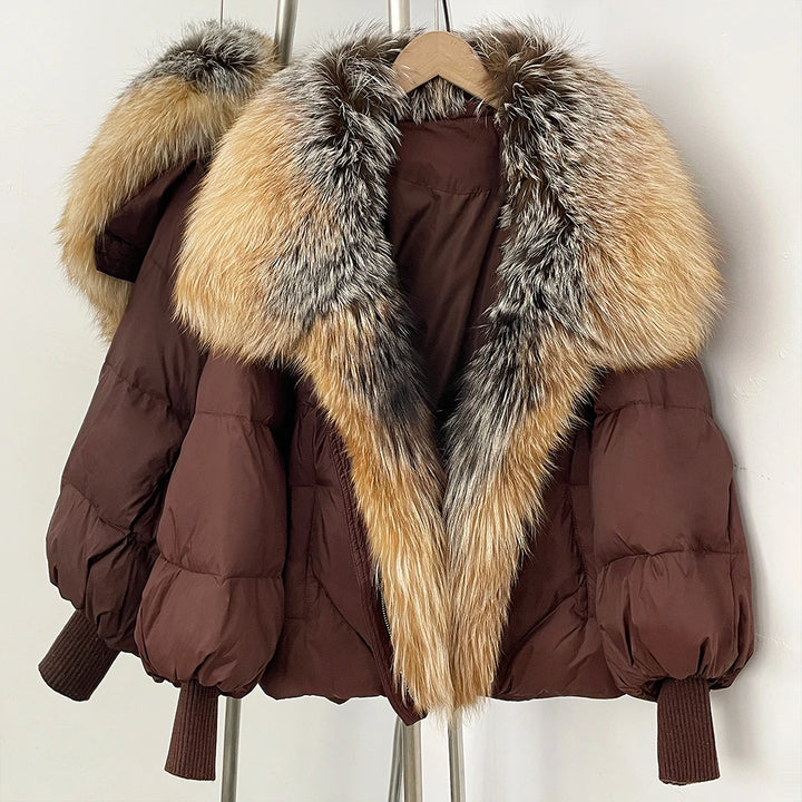 Deep brown puffer coat with tan and gray faux-fur hood trim, ribbed knit cuffs