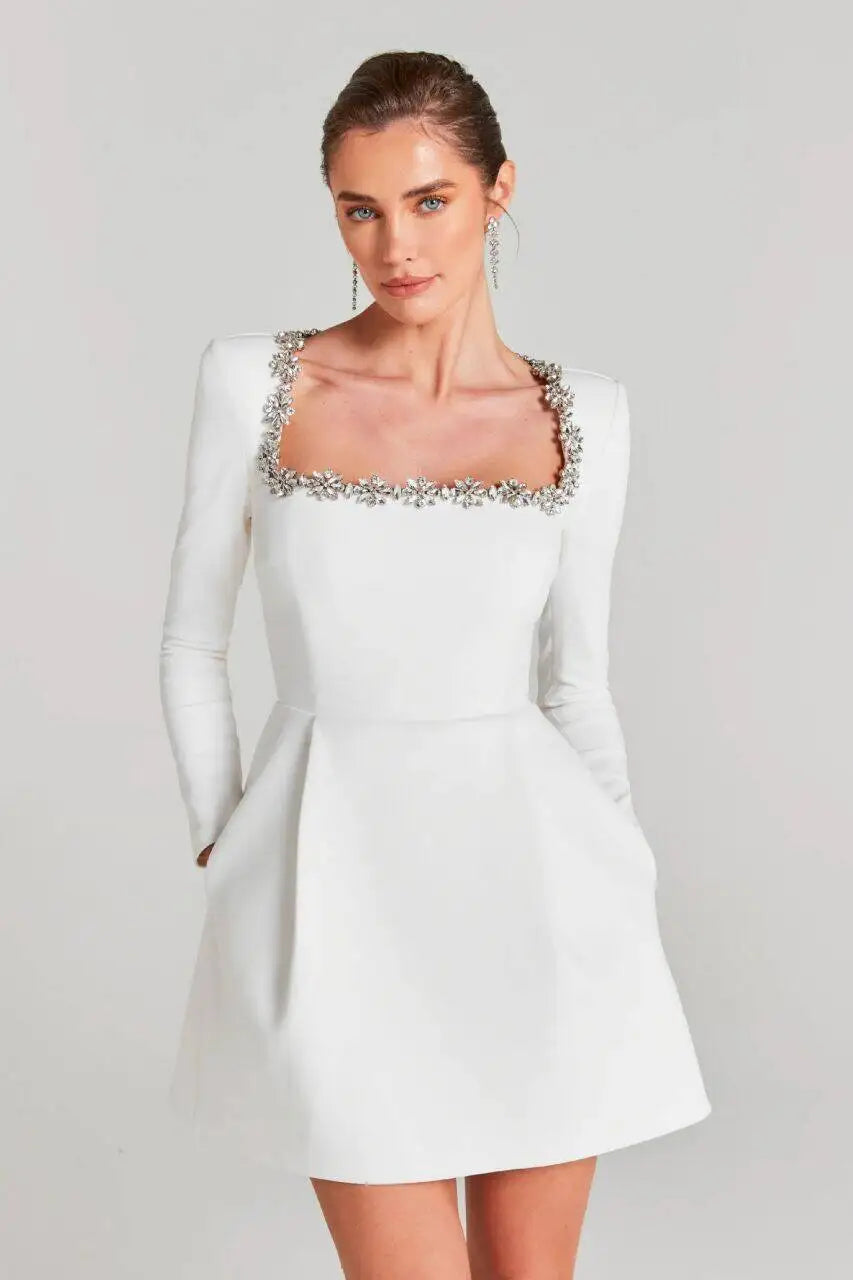White square-neck mini dress with long sleeves and jeweled embellished trim