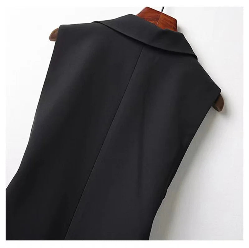 Black sleeveless blazer vest close-up of back panel and shoulder seam