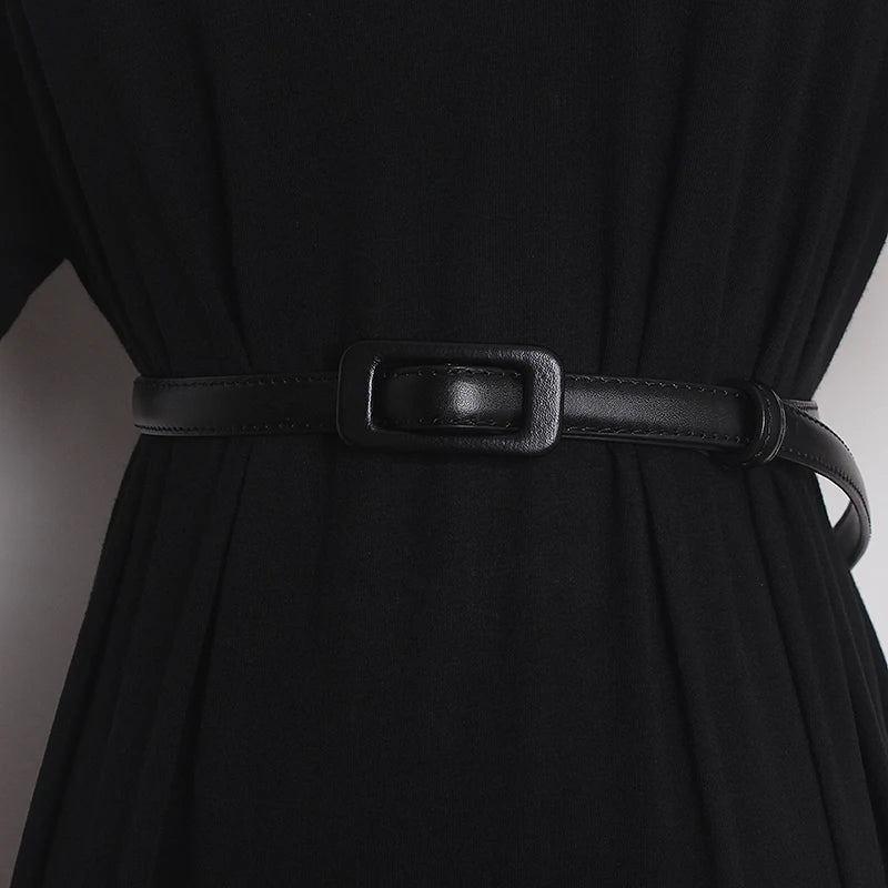 Black narrow leather belt with rectangular black buckle and stitched strap