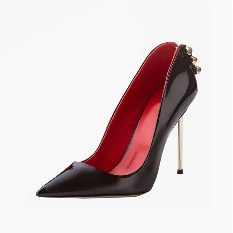 Black leather heel pump with pointed toe, red interior, gold studs, stiletto heel