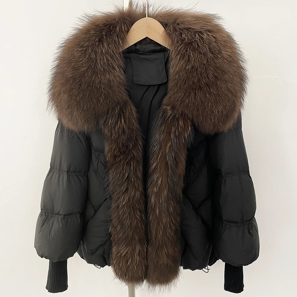 Black puffer coat with oversized dark brown faux-fur collar and front zip, rib-knit cuffs