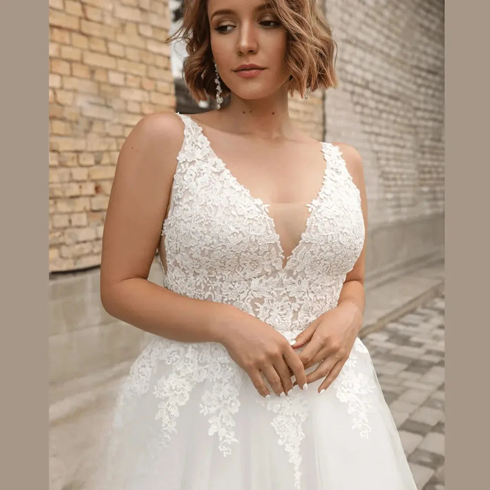 Classic plus size tulle wedding dress with lace sleeveless V-neck bodice detail