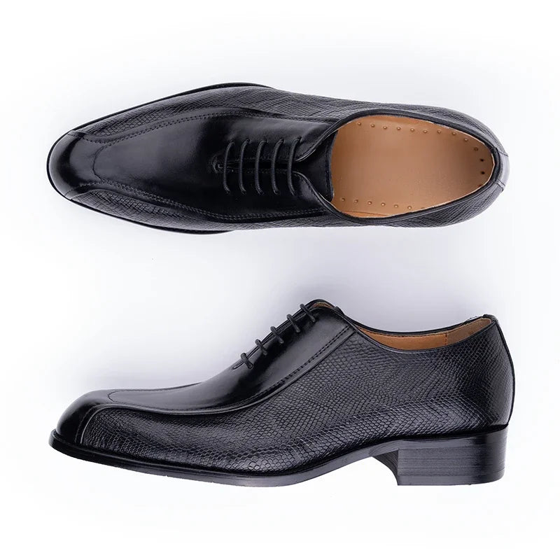 Black leather lace-up oxford dress shoes, side view with tan interior lining.