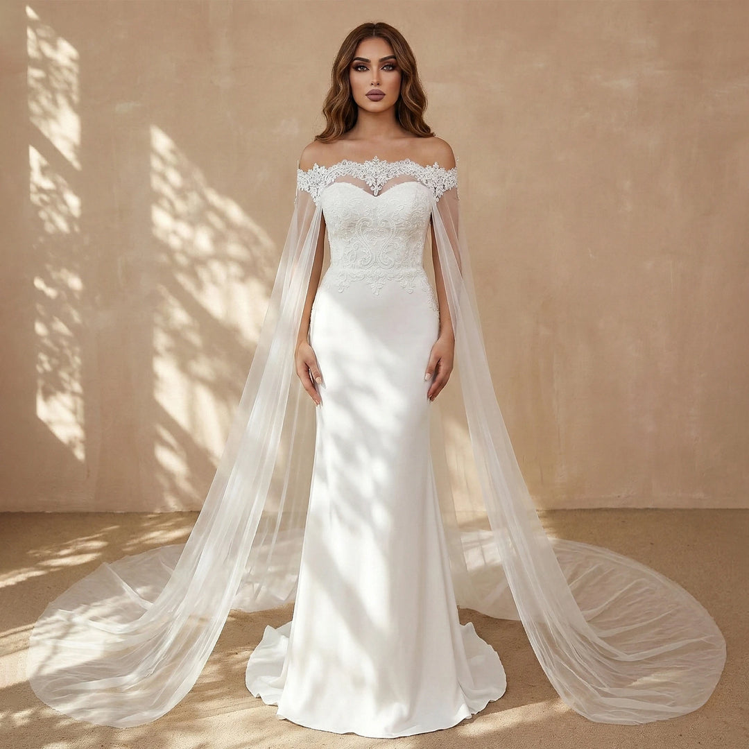 Off-white bridal gown with off-shoulder lace bodice and long sheer tulle veil