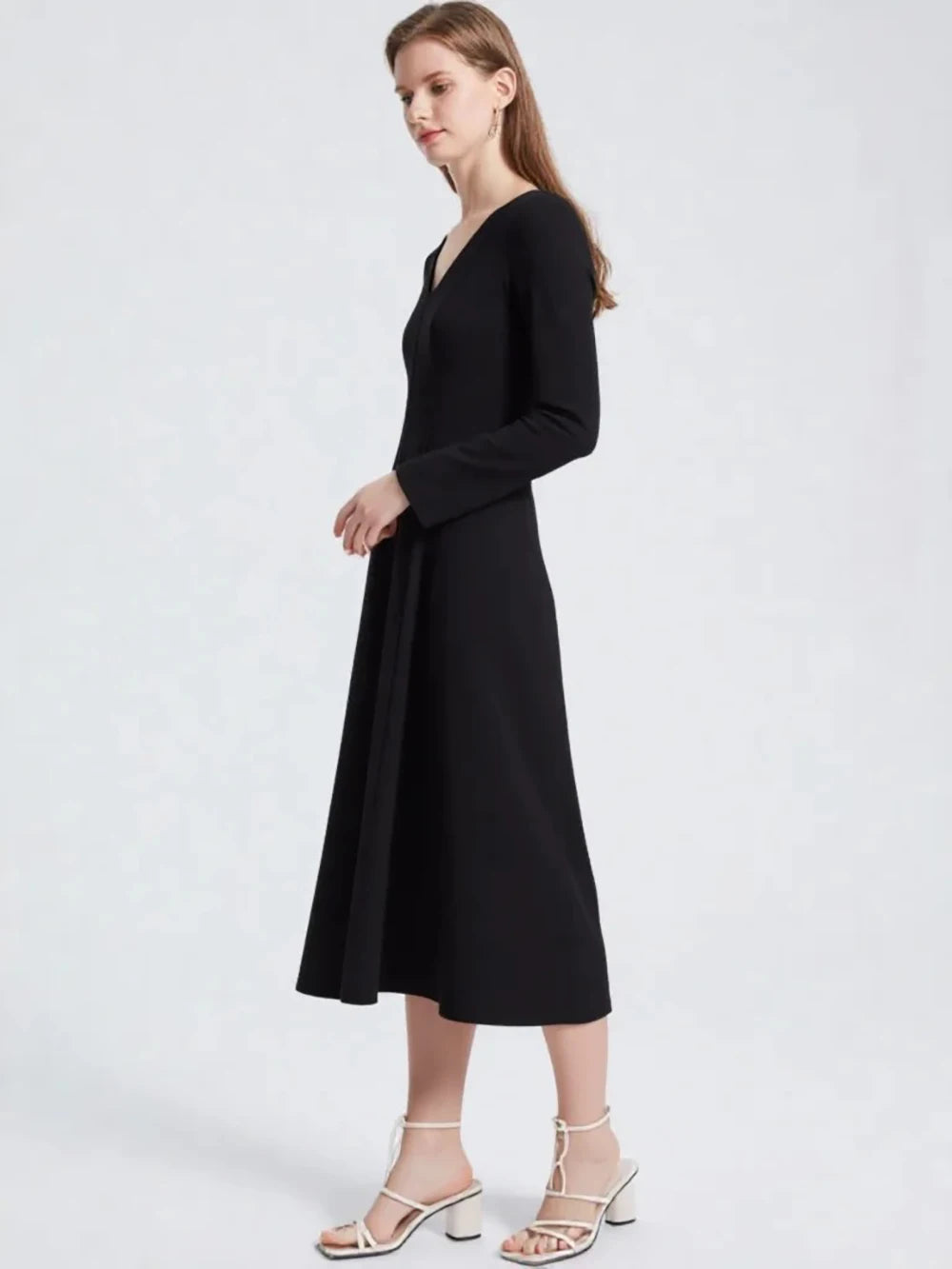 Black A-line mid-calf dress with long sleeves and V-neckline