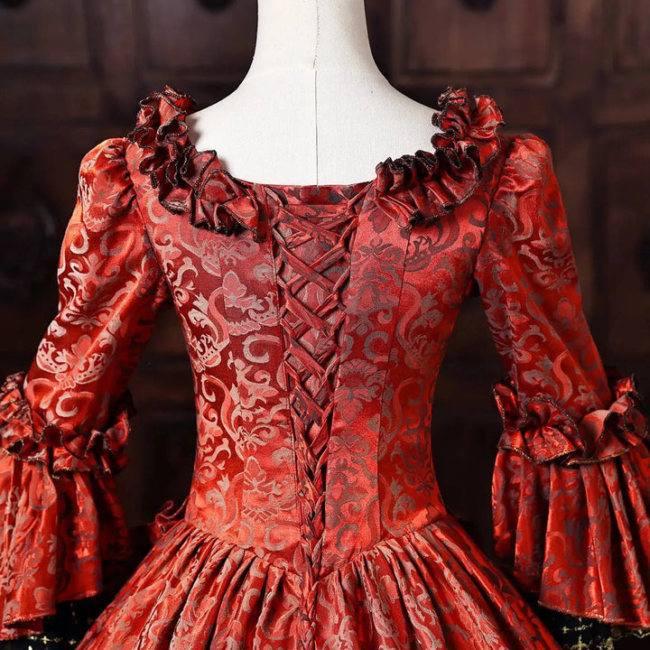 Wine-red patterned bodice with off-shoulder ruffles and laced front, long tiered sleeves