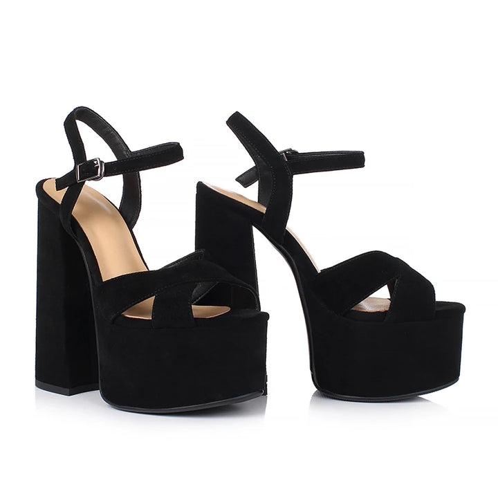 Black suede platform heeled sandals with ankle strap and T-strap cutouts