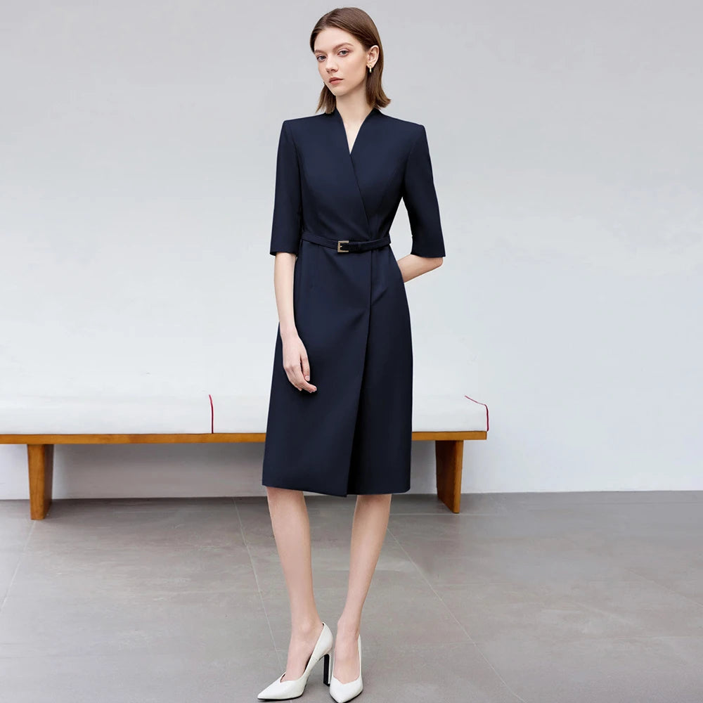 Knee-length navy skirt suit dress with V-neck, 3/4 sleeves, and waist belt