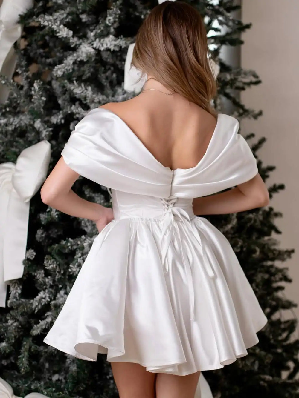 White satin off-shoulder short wedding dress, open back with bow detail