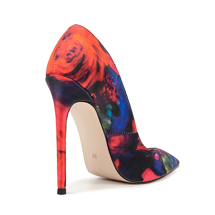 Women’s high heel pump with pointed toe, multicolor patchwork print, red stiletto heel