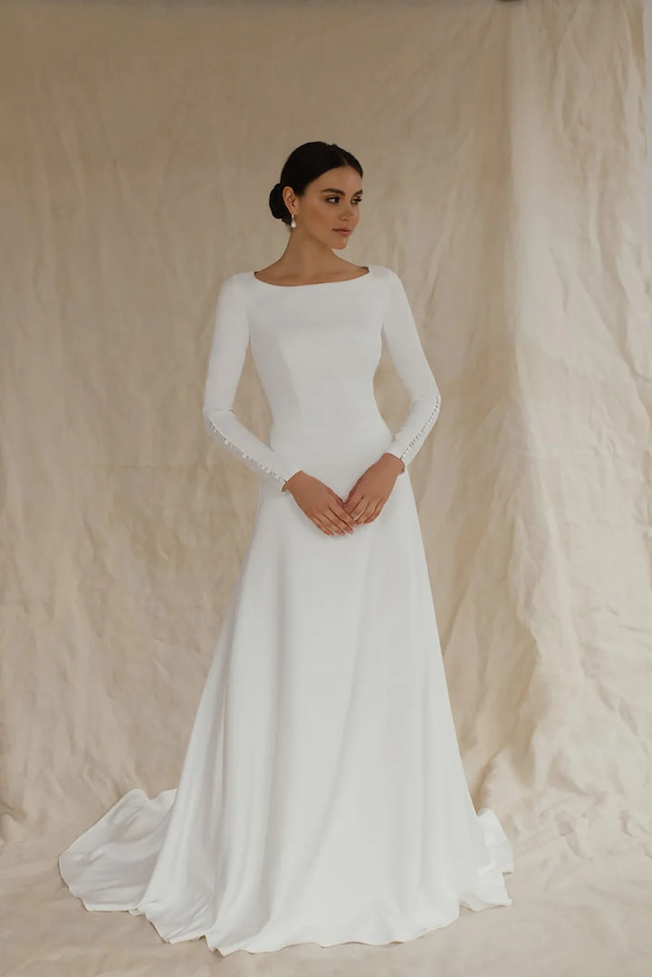 White A-line wedding dress with long sleeves and round neckline