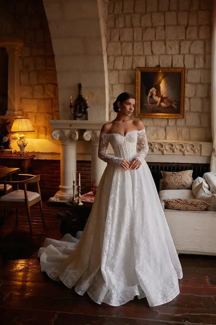 White lace wedding gown with off-shoulder bodice and full A-line skirt