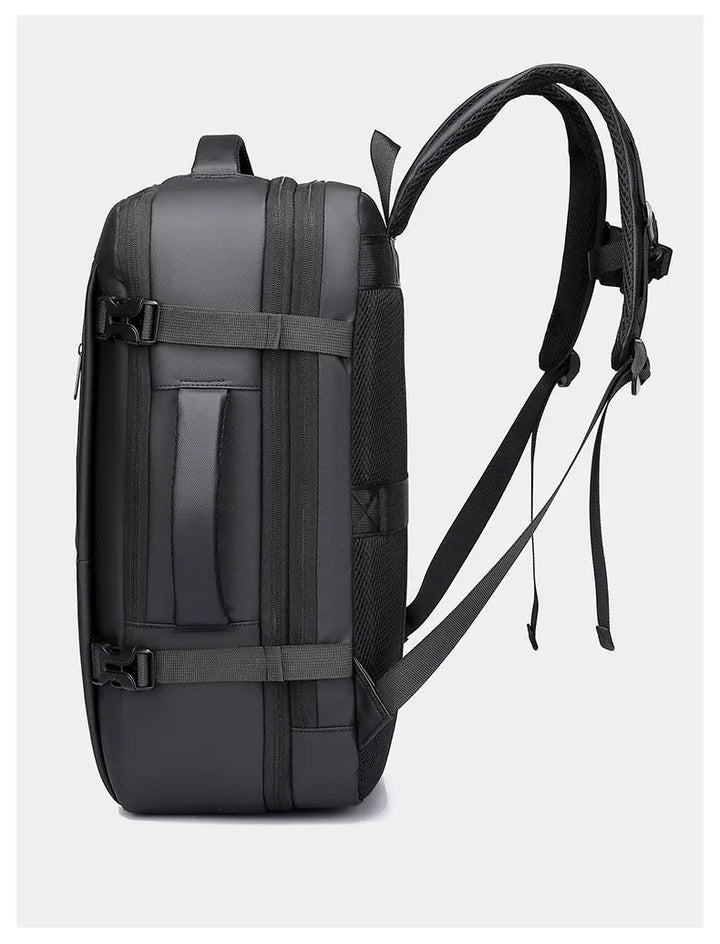 Black travel backpack side view with adjustable straps and reinforced panel stitching