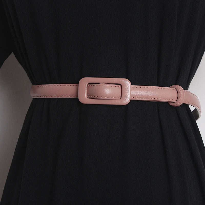 Pink narrow leather belt with rectangular buckle and stitched strap