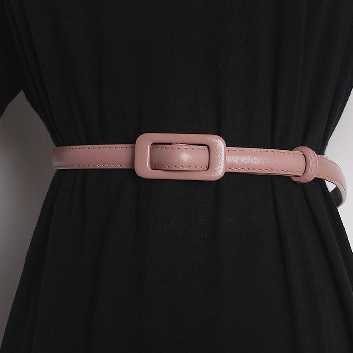 Pink narrow leather belt with rectangular buckle and stitched strap