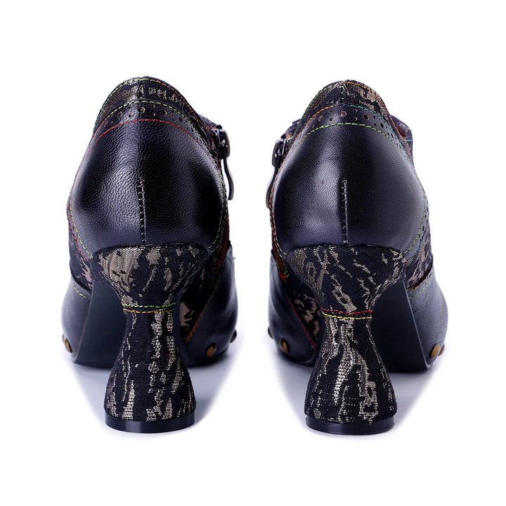 Women’s leather heel pumps, dark blue back view with snake-print heel area
