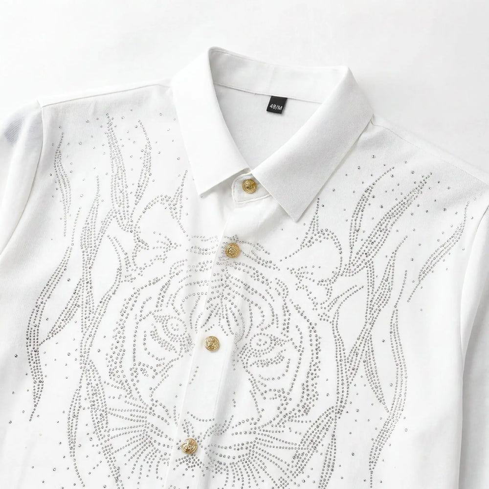 White slim-fit men’s dress shirt close-up with rhinestone floral scroll and gold buttons.