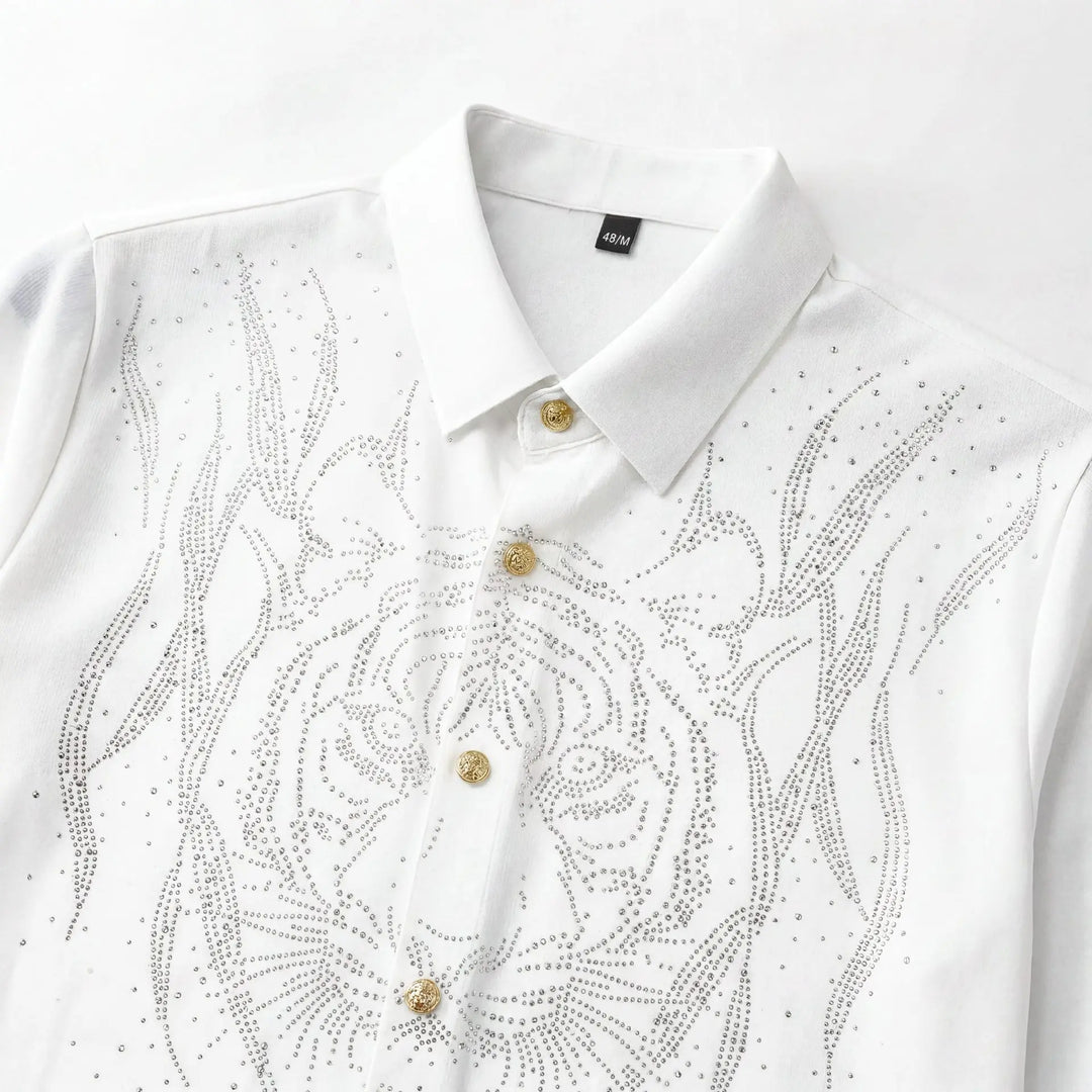 White slim-fit men’s dress shirt close-up with rhinestone floral scroll and gold buttons.