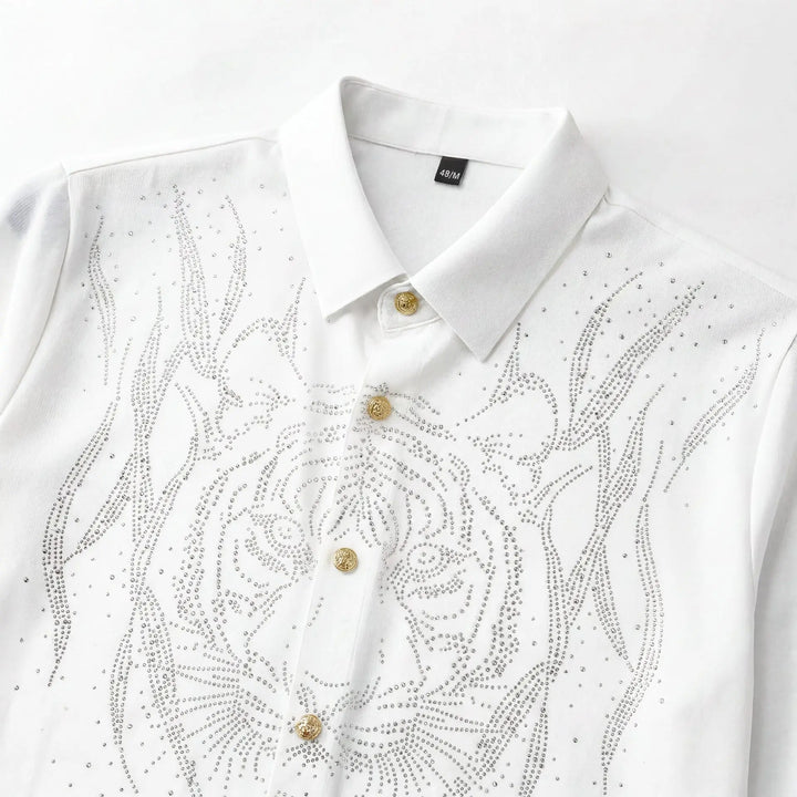 White slim-fit men’s dress shirt close-up with rhinestone floral scroll and gold buttons.