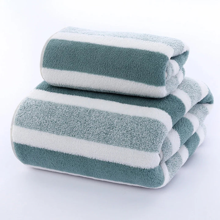 Folded green-and-white striped terry towel set, two towels stacked