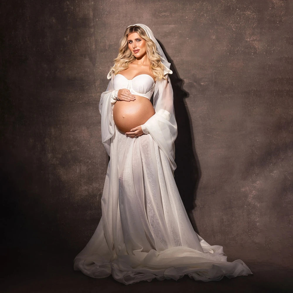 Women’s white maternity robe dress with long veil sleeves and flowing skirt
