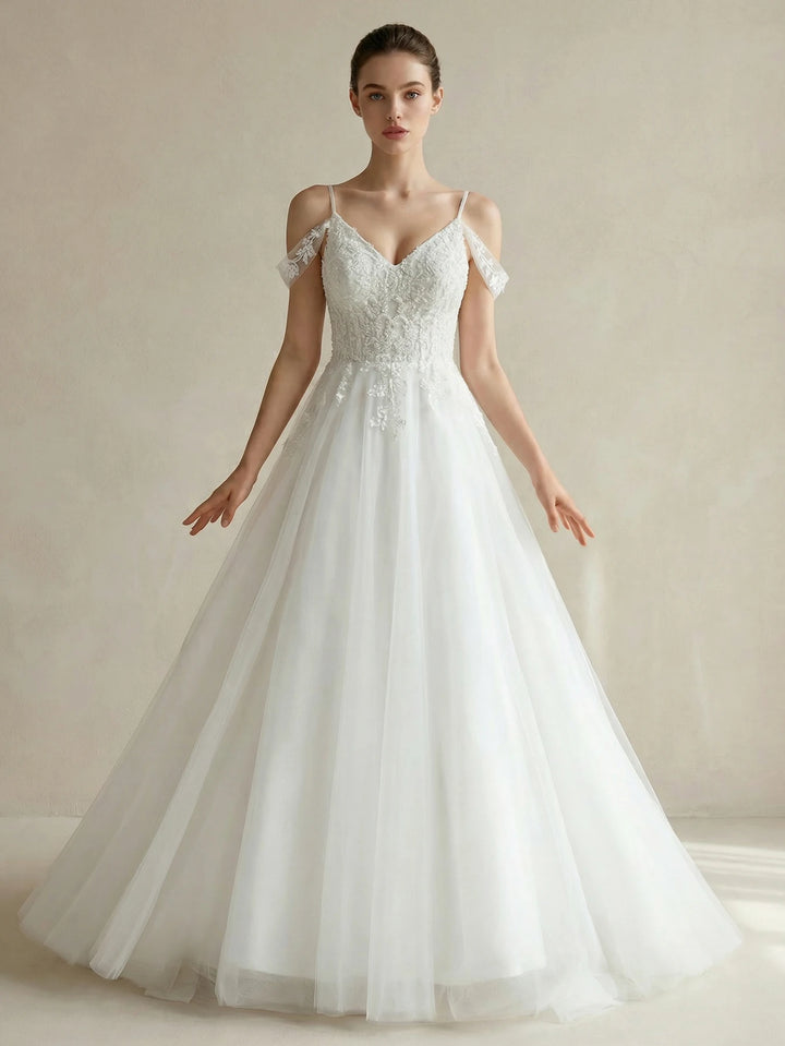 White off-shoulder beaded bridal gown with V-neck bodice and flowing tulle skirt