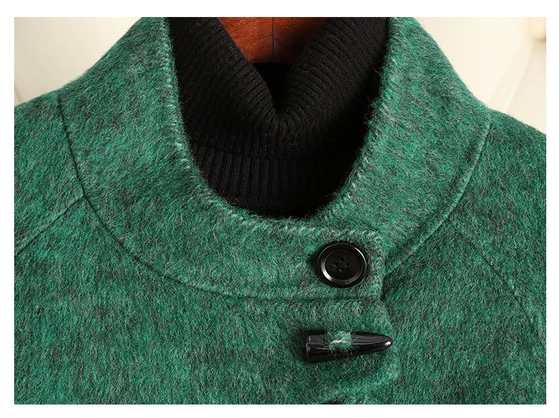 Green wool-blend coat neckline detail with black rib collar and button closure