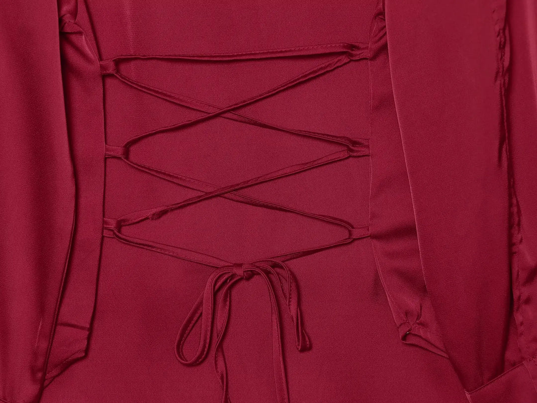 Red satin blouse back with lace-up string tie detail