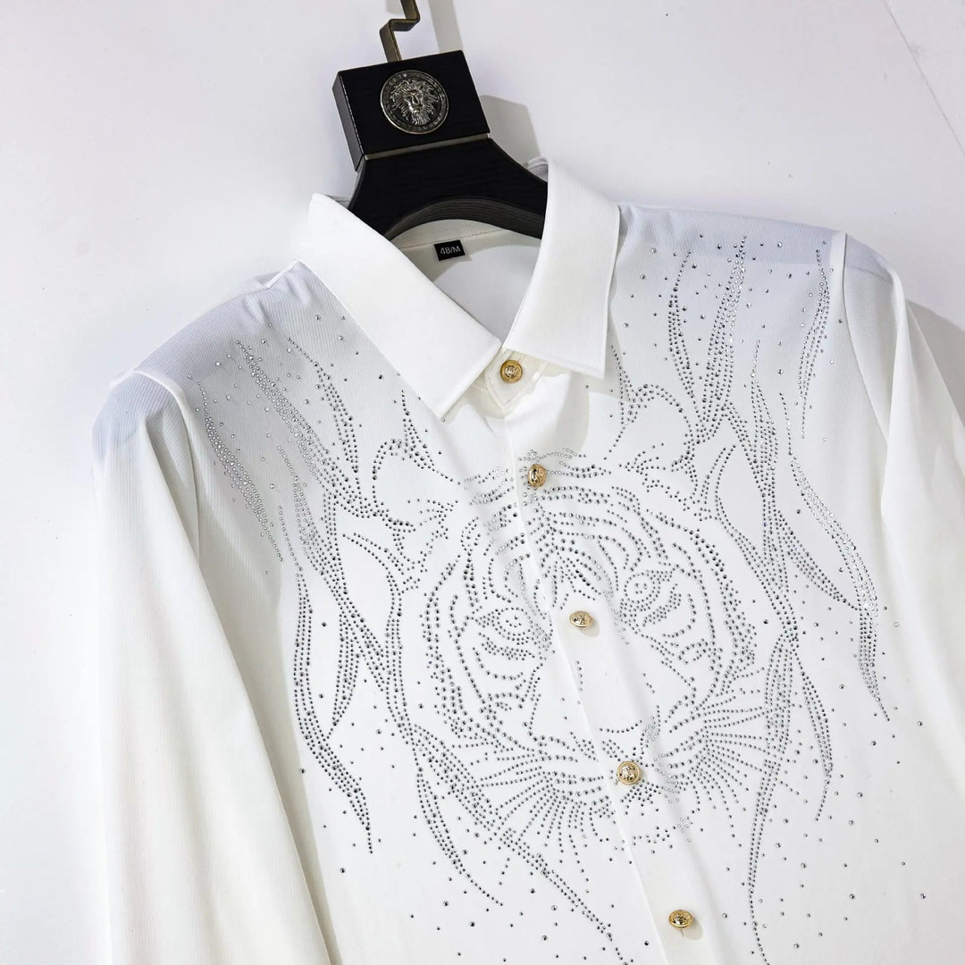 White slim-fit men’s dress shirt with rhinestone chest design, pointed collar, gold buttons.