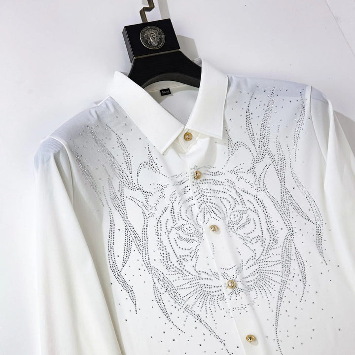 White slim-fit men’s dress shirt with rhinestone chest design, pointed collar, gold buttons.