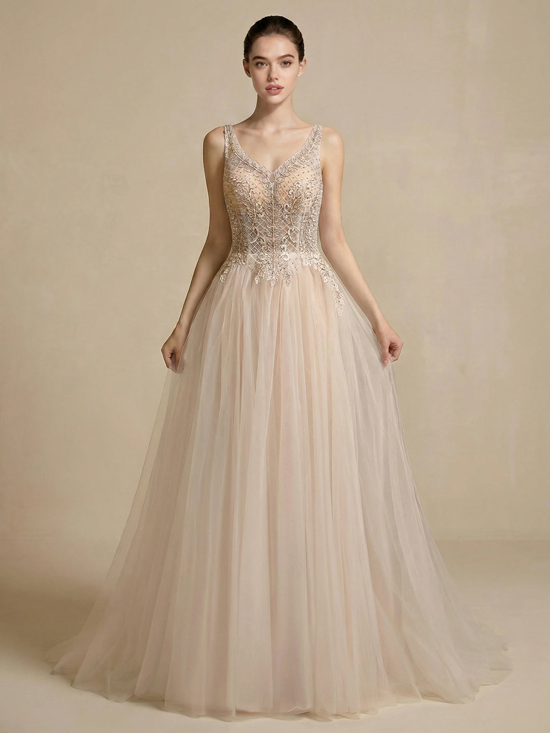 Ivory A-line bridal gown with V-neck beaded mesh bodice, spaghetti straps, tulle skirt