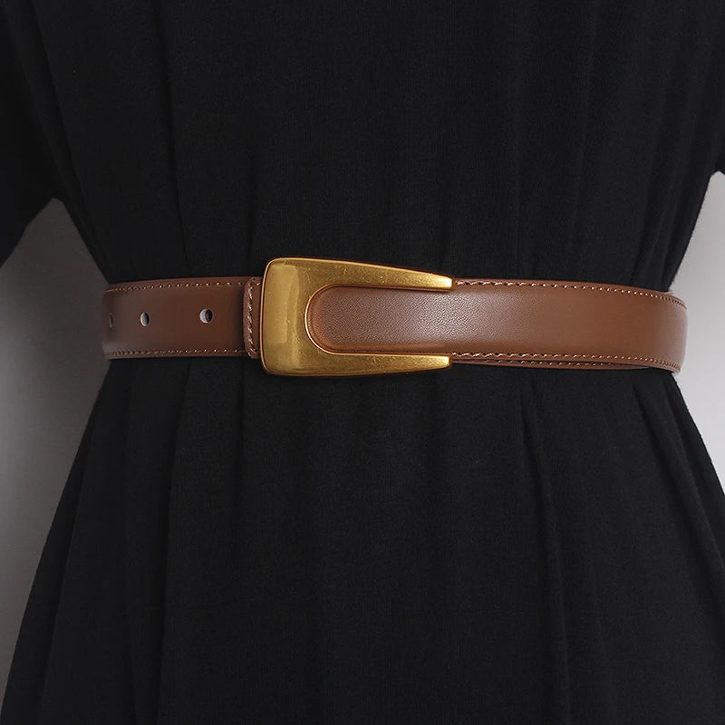 Narrow camel brown leather waist belt with gold-tone rectangular buckle and adjustment holes