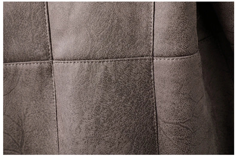 Grey suede-look trench coat fabric panel with stitched seams and texture