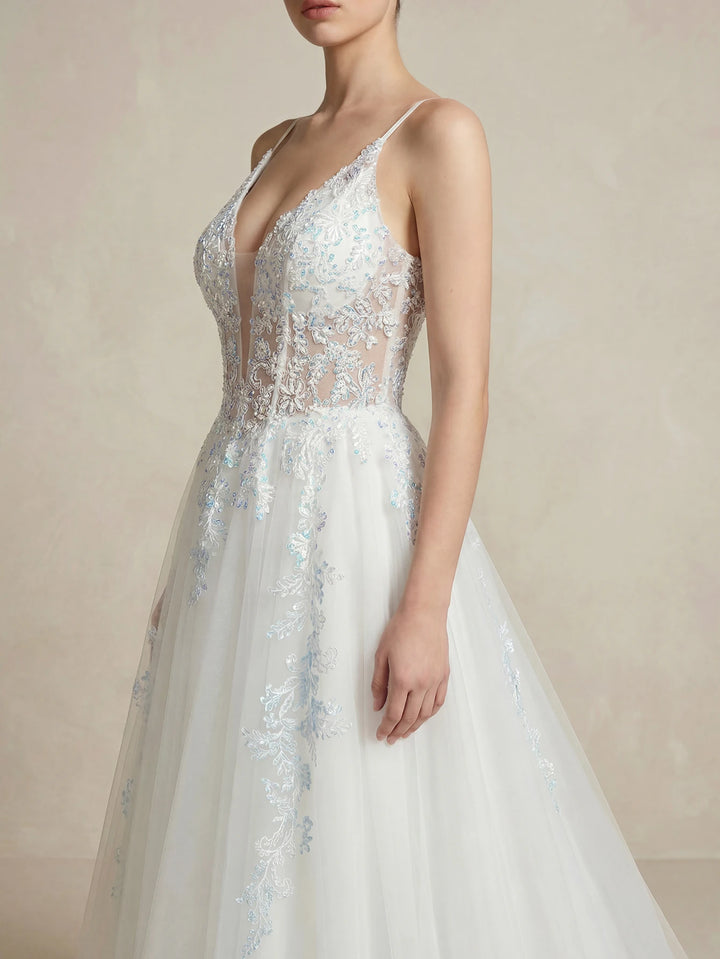 White lace embroidered bridal dress with deep V neckline and delicate lace appliques