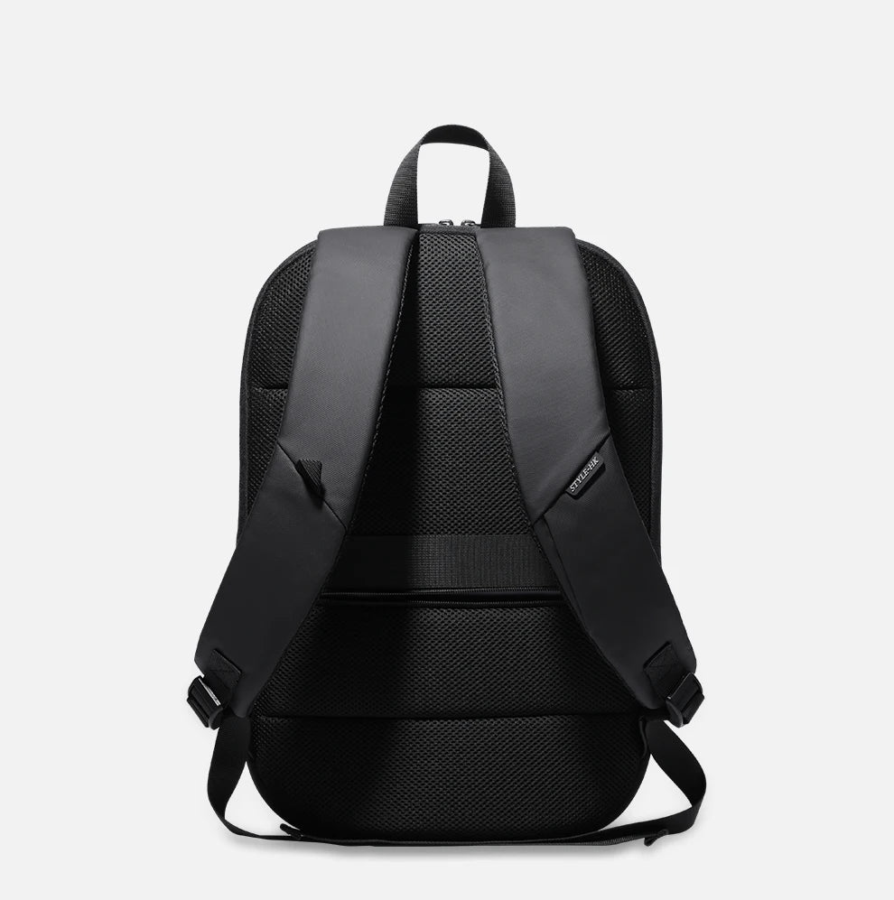 Black travel backpack with back straps and breathable mesh panel
