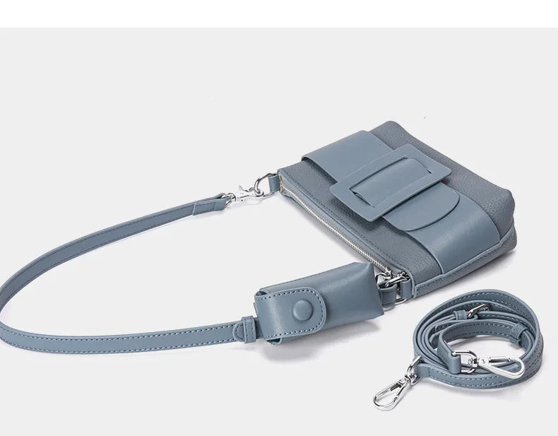 Gray handbag with a strap on a white background