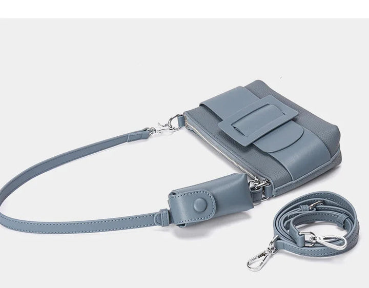 Gray handbag with a strap on a white background