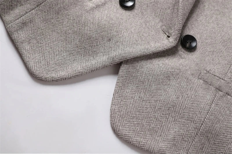 Padded waistcoat front with black buttons and angled flap pockets