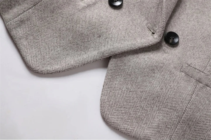 Padded waistcoat front with black buttons and angled flap pockets