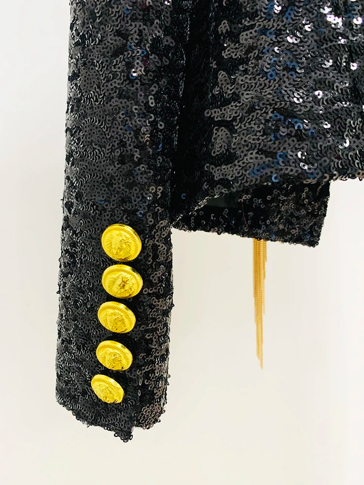 Black sequined jacket cuff with gold buttons and long gold fringe tassels