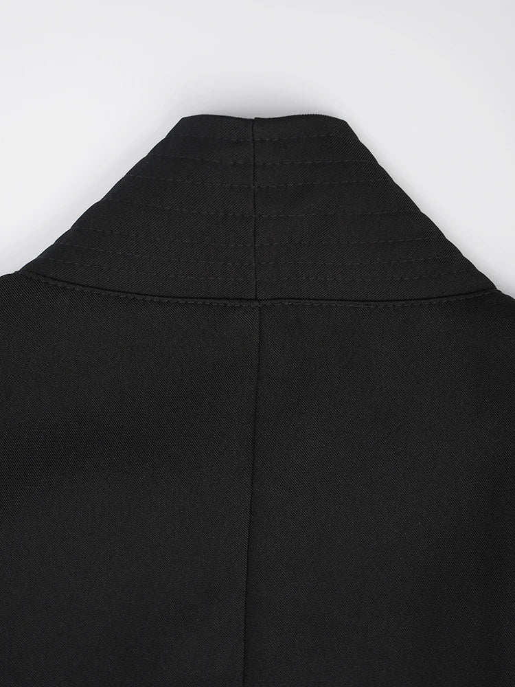 Black vest with high neck and curved yoke seam lines