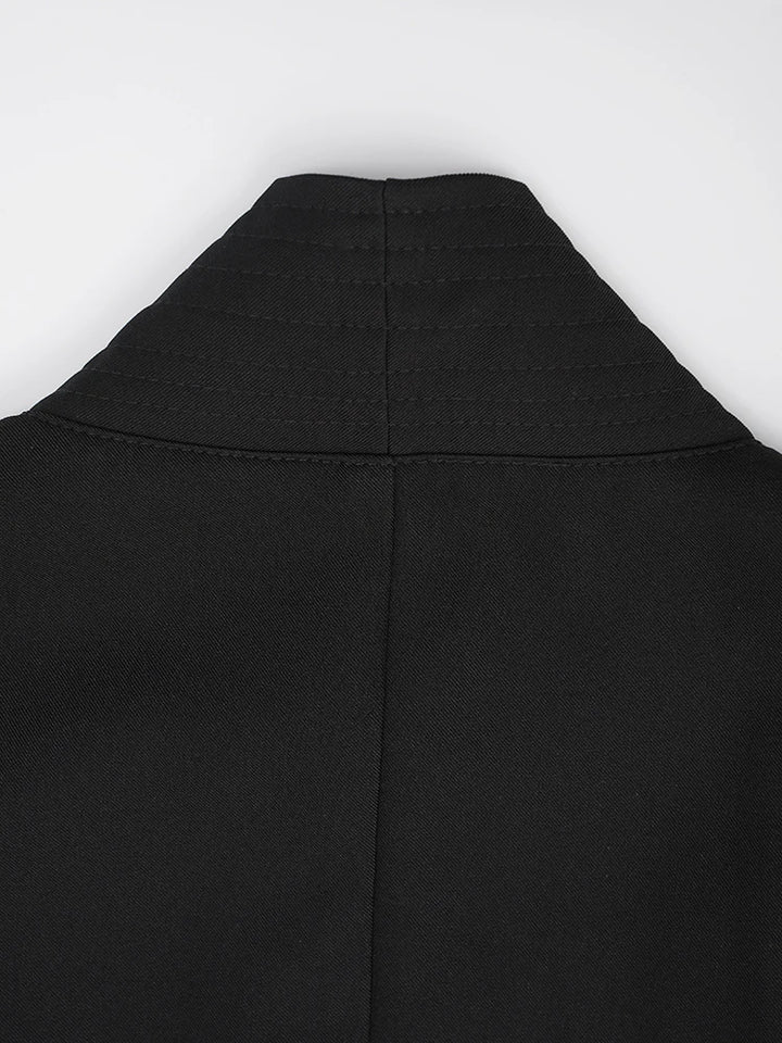 Black vest with high neck and curved yoke seam lines