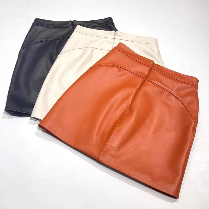 High-waist leather mini skirt, orange with curved seam details
