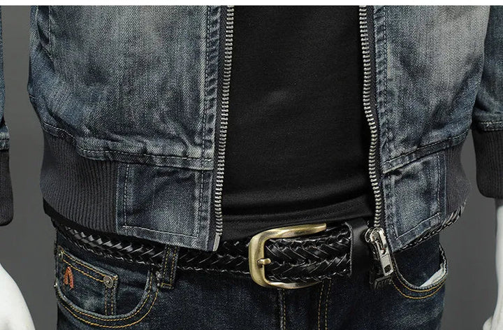 Blue denim zip-up jacket label patch near hem and front zipper