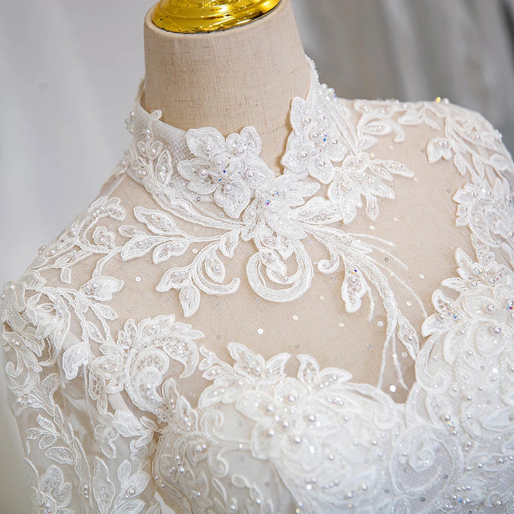 Ivory sheer lace bodice with high neckline, floral appliques and sparkling beadwork