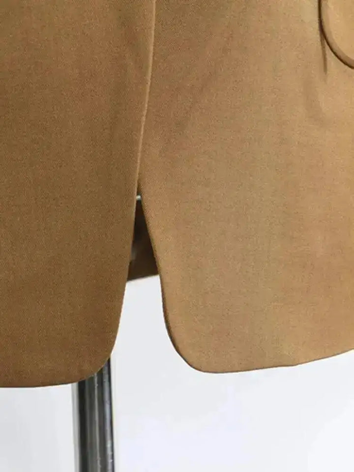 Brown slim-fit blazer, side view with single vent hem