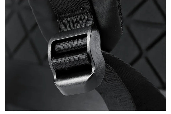 Black rucksack adjusting buckle on shoulder strap attachment