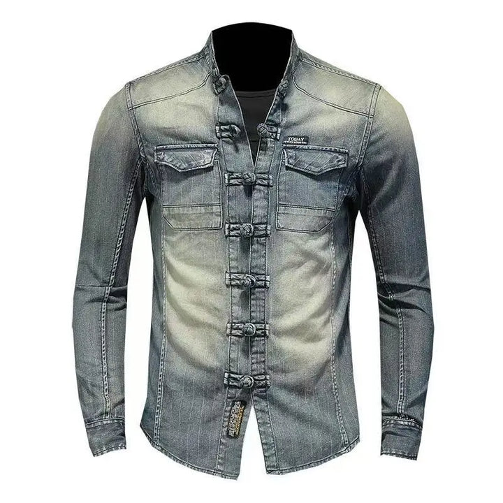 Men’s light blue denim shirt with stand collar, button placket, and chest flap pockets