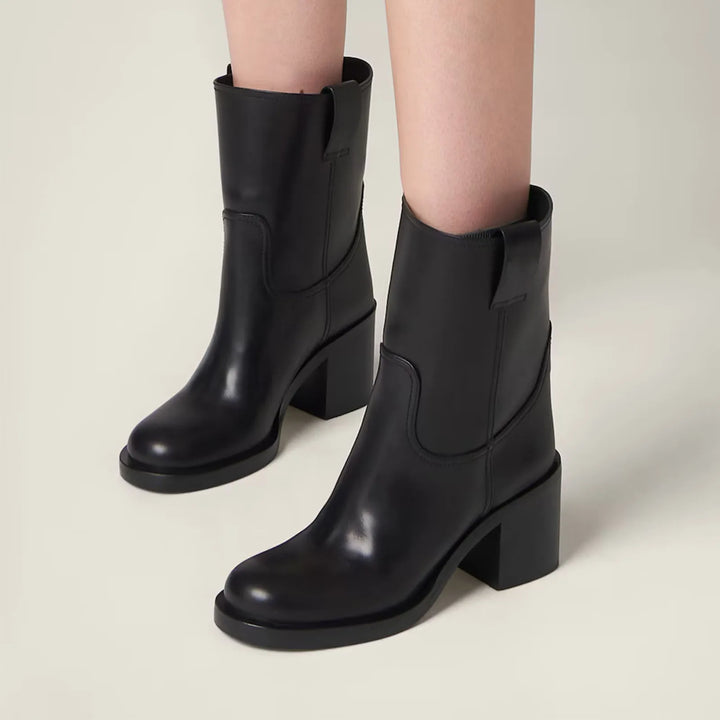 Black ankle boots on block heels with pull tabs and rounded toe